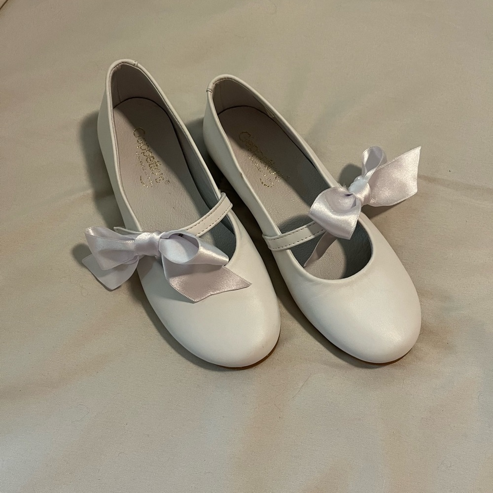 Pearl White leather Geppetto’s  Mary Janes with bow detail. Never worn.